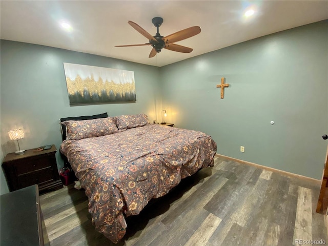 bedroom featuring wood-type flooring and ceiling fan