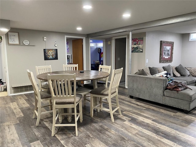 dining room with dark hardwood / wood-style floors