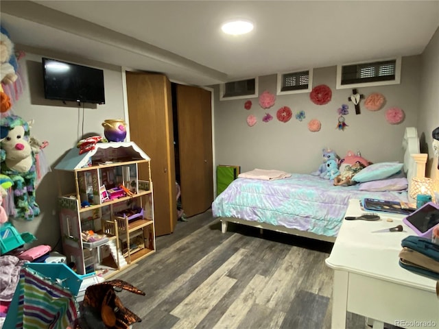 bedroom featuring dark hardwood / wood-style flooring