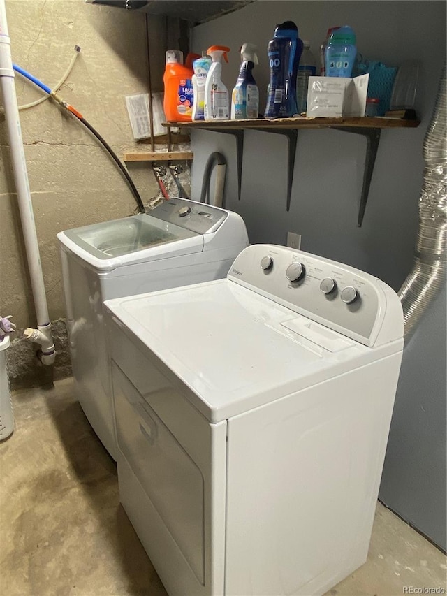 laundry room featuring washing machine and clothes dryer