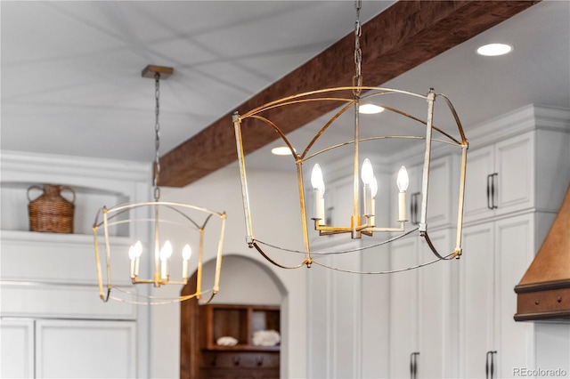 detailed view of a chandelier and recessed lighting