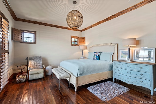 bedroom with multiple windows, hardwood / wood-style floors, ornamental molding, and baseboards