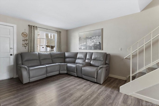 living room with stairs, wood finished floors, and baseboards