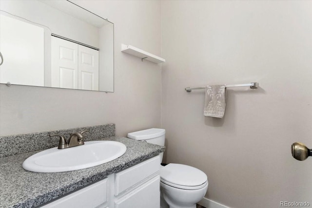 bathroom with vanity and toilet