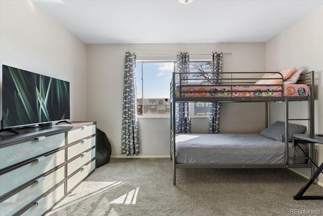 carpeted bedroom with baseboards