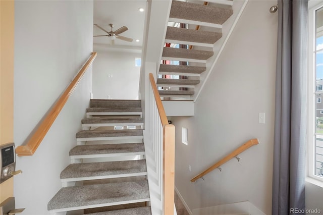 stairway with ceiling fan