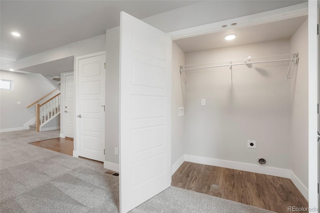 laundry area featuring hookup for an electric dryer and carpet