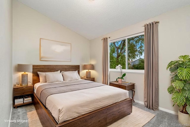 2954 E 101st Ave, Thornton, CO 80229 - bedroom featuring light carpet, vaulted ceiling, a textured ceiling, and baseboards