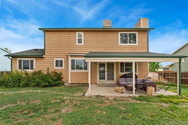2954 E 101st Ave, Thornton, CO 80229 - rear view of house with a chimney, a patio, outdoor lounge area, and central AC
