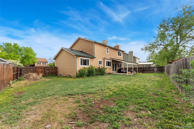 2954 E 101st Ave, Thornton, CO 80229 - back of property featuring a chimney and a patio area