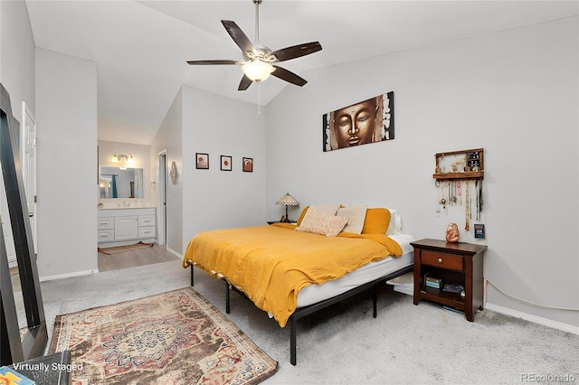 2954 E 101st Ave, Thornton, CO 80229 - bedroom featuring light carpet, vaulted ceiling, baseboards, ensuite bath, and a ceiling fan