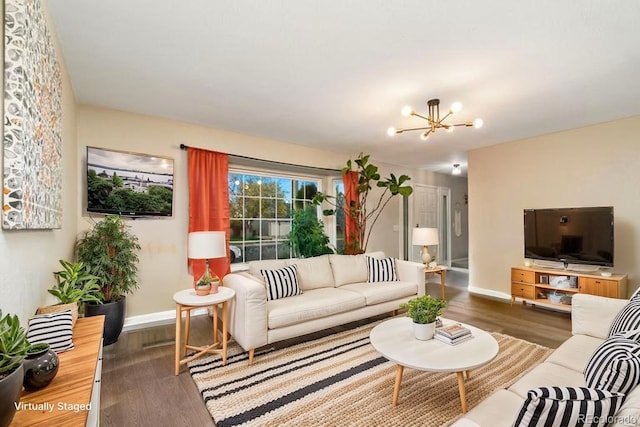 2954 E 101st Ave, Thornton, CO 80229 - living room with wood finished floors, baseboards, and a chandelier