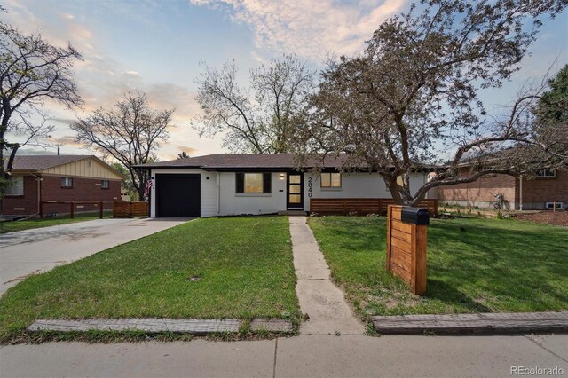 2840 Cottonwood Dr, Denver, CO 80221 - single story home featuring an attached garage, driveway, fence, and a front lawn