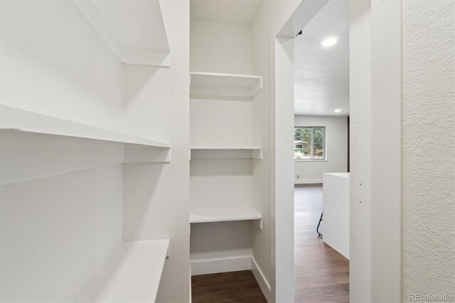 2840 Cottonwood Dr, Denver, CO 80221 - spacious closet featuring dark wood finished floors