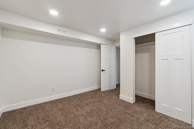 2840 Cottonwood Dr, Denver, CO 80221 - unfurnished bedroom featuring visible vents, baseboards, dark carpet, and recessed lighting