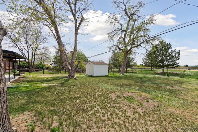 2840 Cottonwood Dr, Denver, CO 80221 - view of yard featuring an outbuilding, a shed, and fence