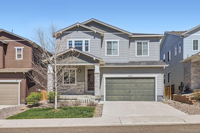 craftsman-style home with a garage and driveway