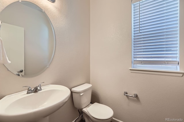 bathroom with a sink and toilet