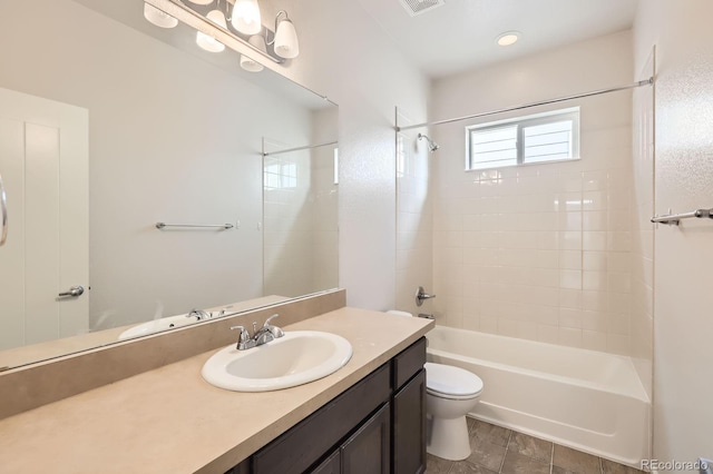 bathroom featuring toilet, visible vents, tub / shower combination, and vanity
