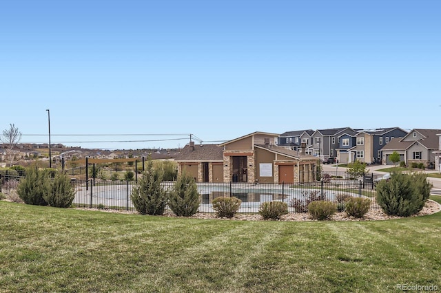exterior space featuring fence and a residential view