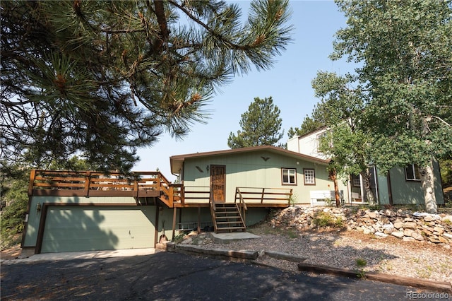 view of front facade with a wooden deck