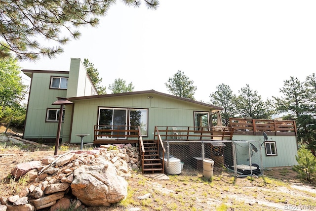 back of house featuring a deck