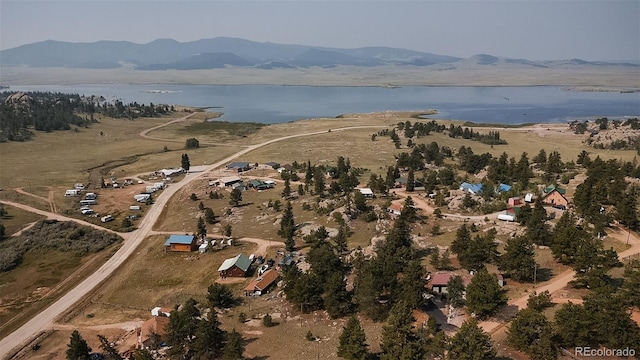 bird's eye view featuring a water and mountain view