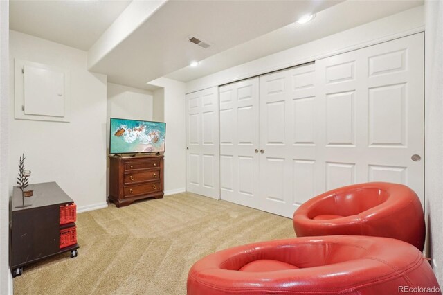 living area featuring baseboards, carpet, and visible vents