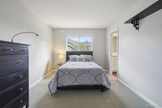 bedroom with carpet flooring and baseboards