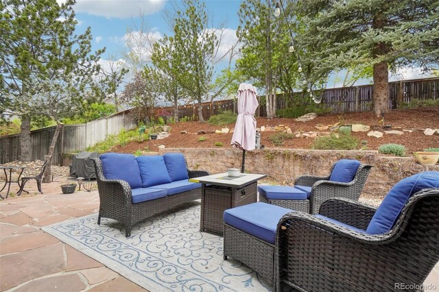 view of patio with a fenced backyard and outdoor lounge area