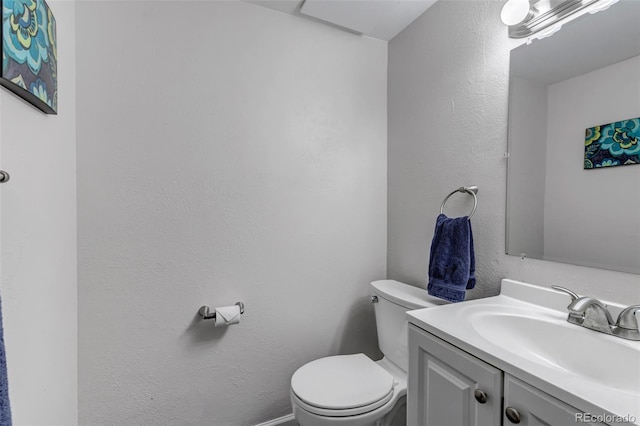 8905 Field St Unit 91, Westminster, CO 80021 - half bath featuring vanity, toilet, and a textured wall