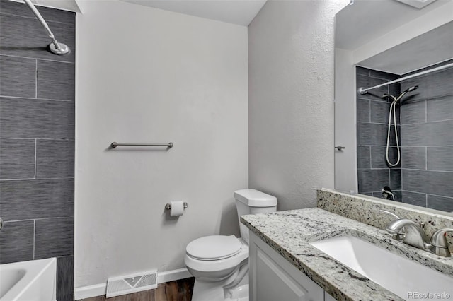 8905 Field St Unit 91, Westminster, CO 80021 - bathroom with vanity, toilet, wood finished floors, baseboards, and bathtub / shower combination