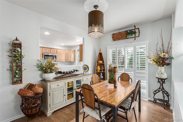 dining space with light hardwood / wood-style flooring