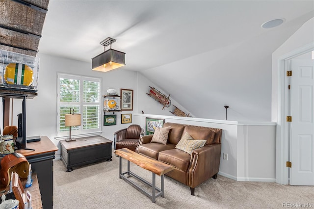 carpeted living room featuring lofted ceiling