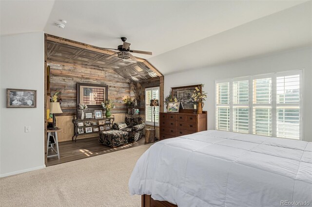 bedroom featuring ceiling fan, lofted ceiling, and hardwood / wood-style floors