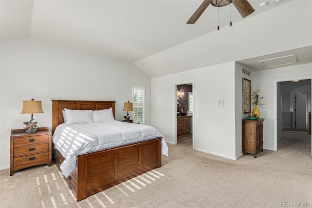 carpeted bedroom featuring vaulted ceiling, ceiling fan, and connected bathroom