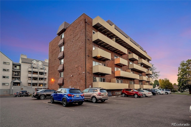 view of property featuring uncovered parking