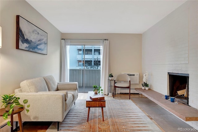 living area with a wall mounted air conditioner, a baseboard radiator, and a brick fireplace