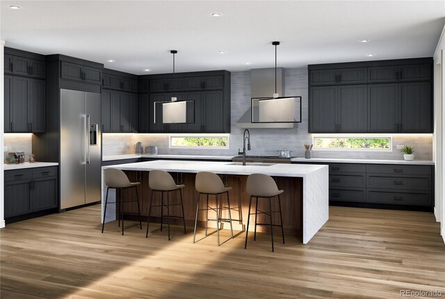 2778 Utica St, Denver, CO 80212 - kitchen featuring high end fridge, light countertops, light wood finished floors, backsplash, and recessed lighting