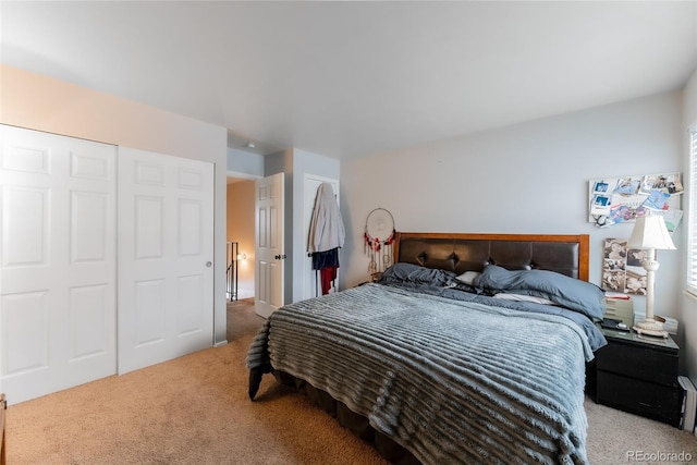 bedroom featuring a closet and carpet flooring