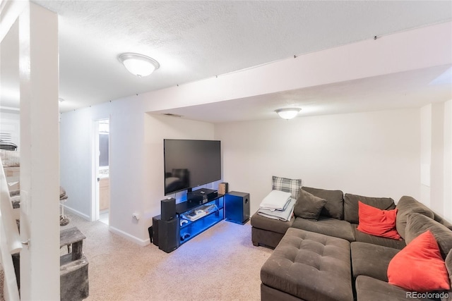 living room featuring light colored carpet and a textured ceiling