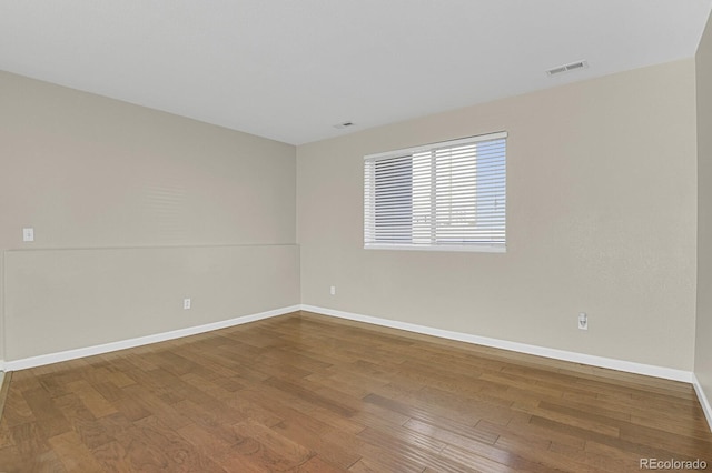 unfurnished room featuring wood-type flooring