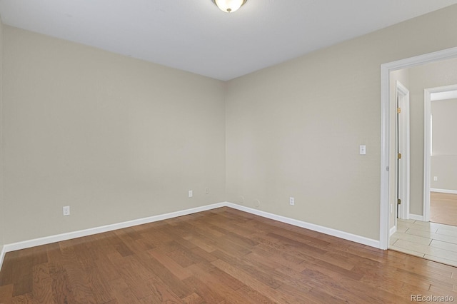 spare room featuring hardwood / wood-style floors