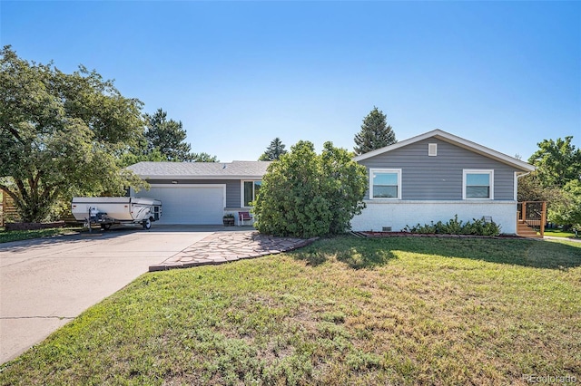 7780 S Kendall Blvd, Littleton, CO 80128 - ranch-style home featuring an attached garage, concrete driveway, a front yard, and brick siding