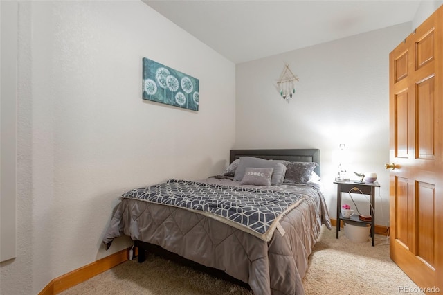 bedroom featuring light colored carpet