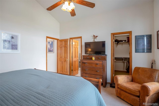 carpeted bedroom with high vaulted ceiling, a closet, a spacious closet, and ceiling fan