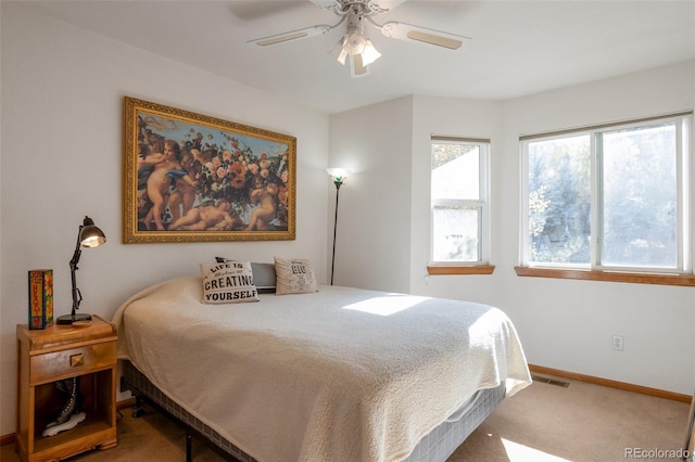 bedroom with ceiling fan and carpet flooring