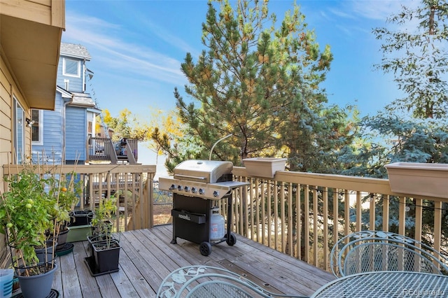 wooden deck featuring grilling area