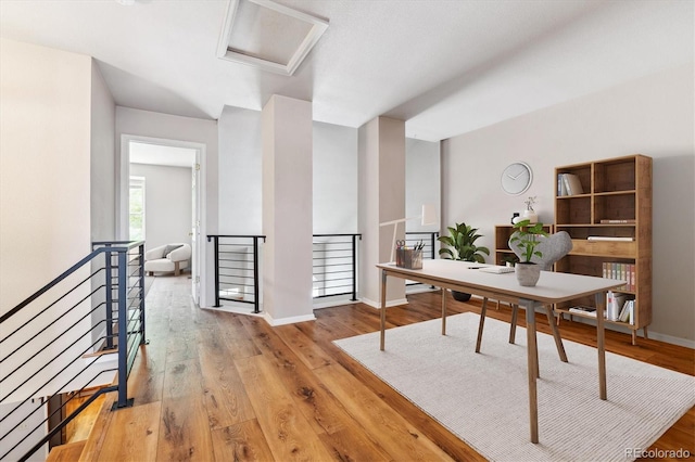 office with light hardwood / wood-style flooring