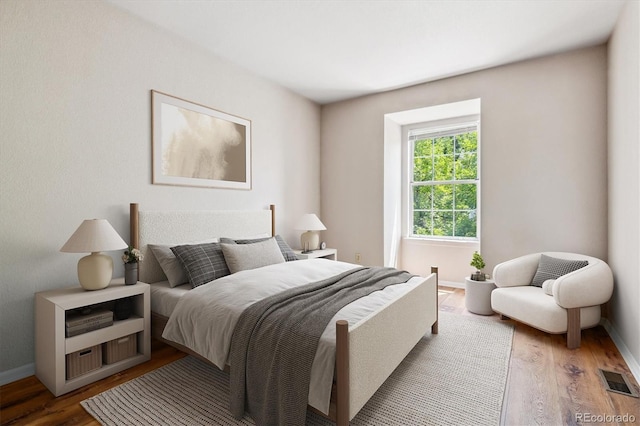 bedroom featuring dark hardwood / wood-style floors